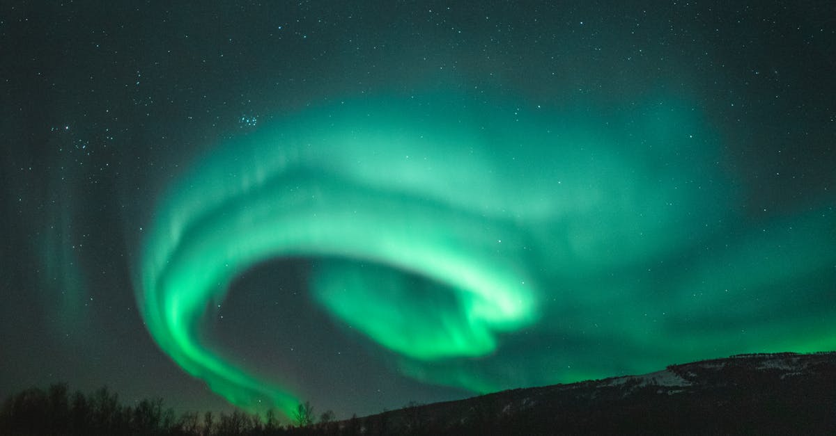 discover the mesmerizing beauty of the northern lights in this stunning photography collection. witness nature's awe-inspiring light show in the arctic skies.