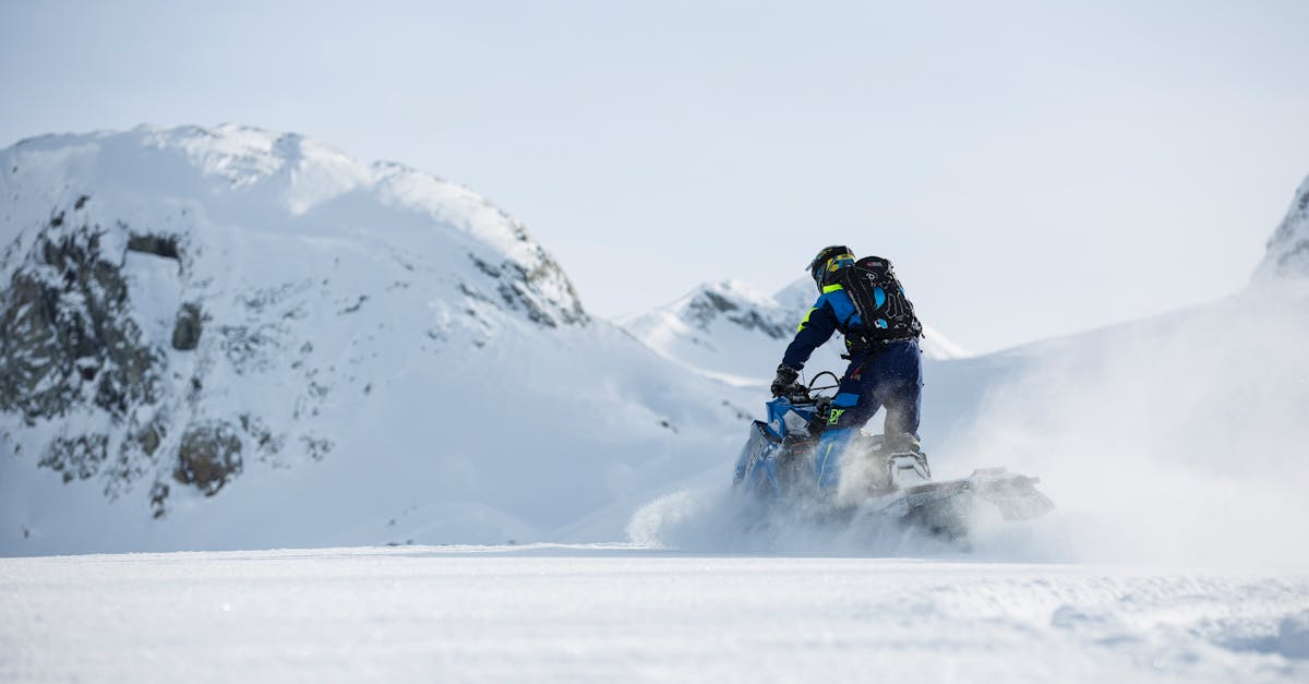 experience the thrill of snowmobiling with breathtaking views and exhilarating adventure in the snowy wilderness.
